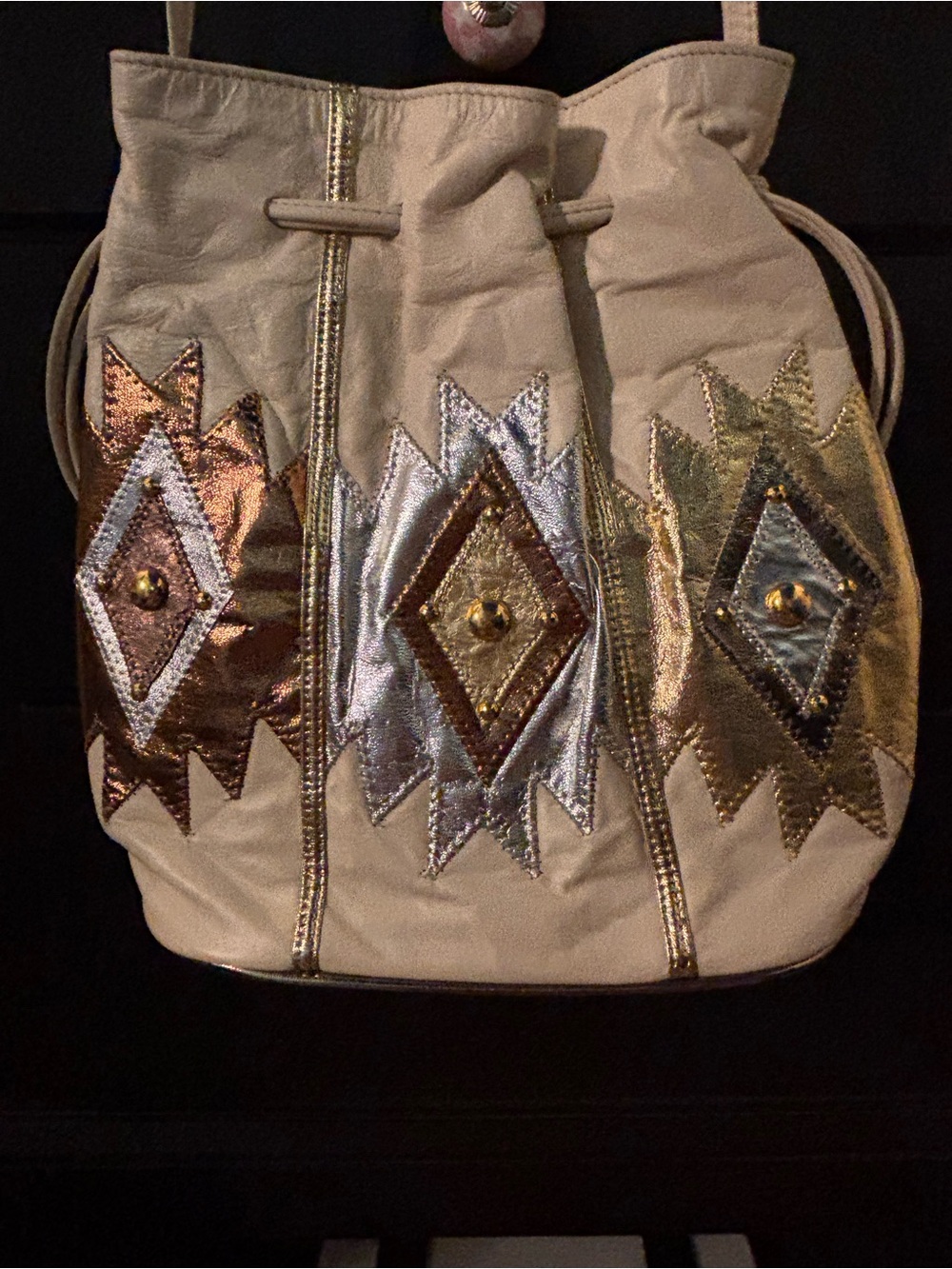 Samir Beige Leather Bucket Bag with copper, silver and gold Aztec embroidery.